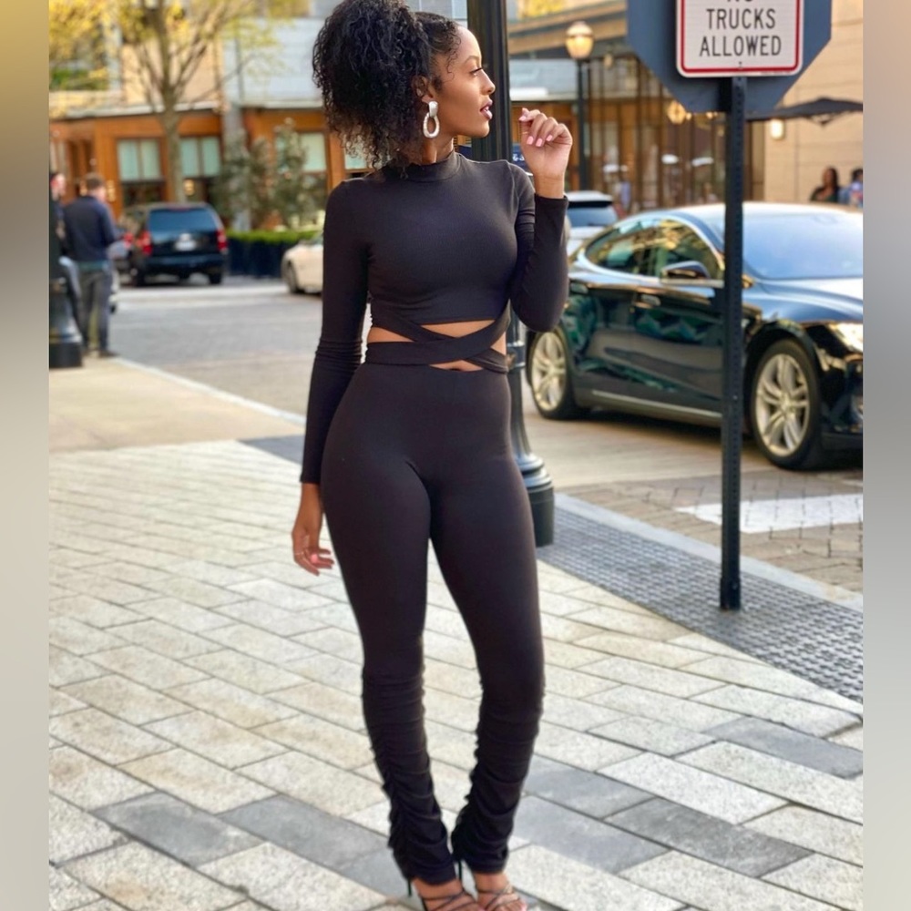 Black two-piece mock neck set with stacked pant